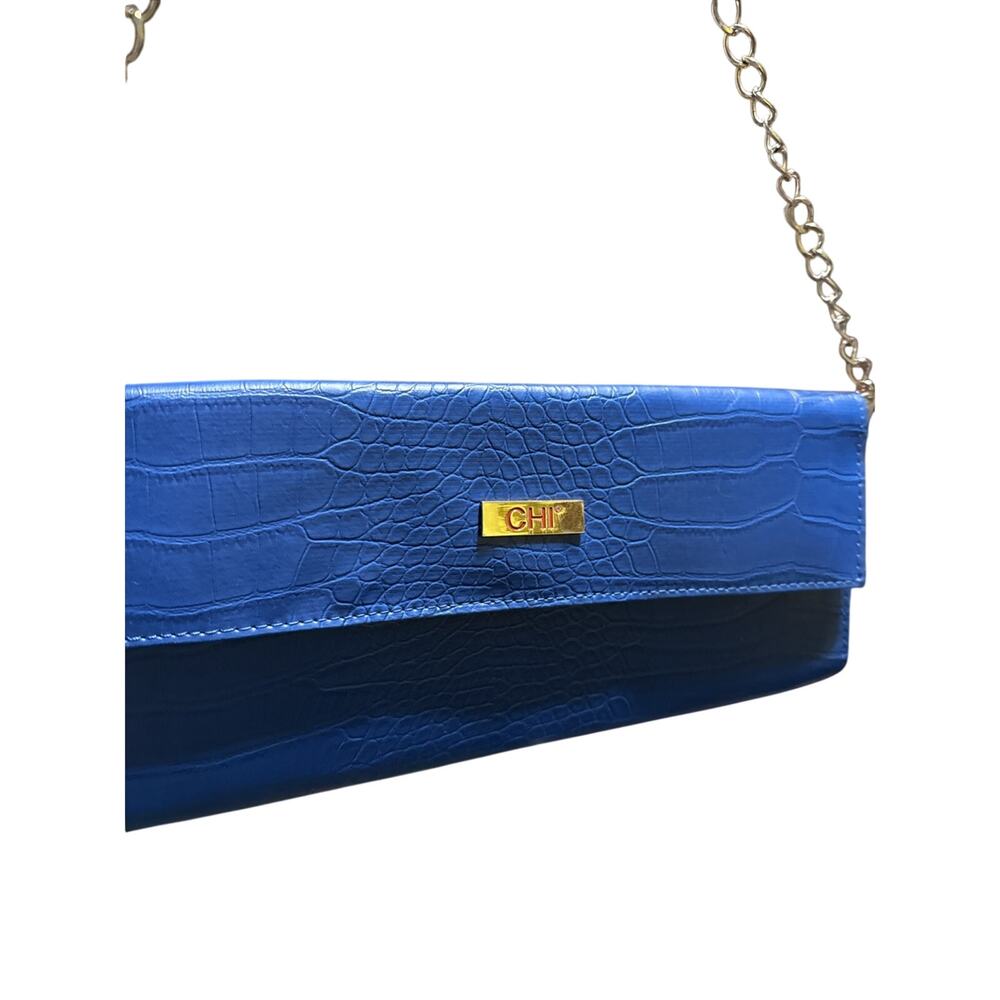 Blue, crocodile-embossed clutch bag by CHI.